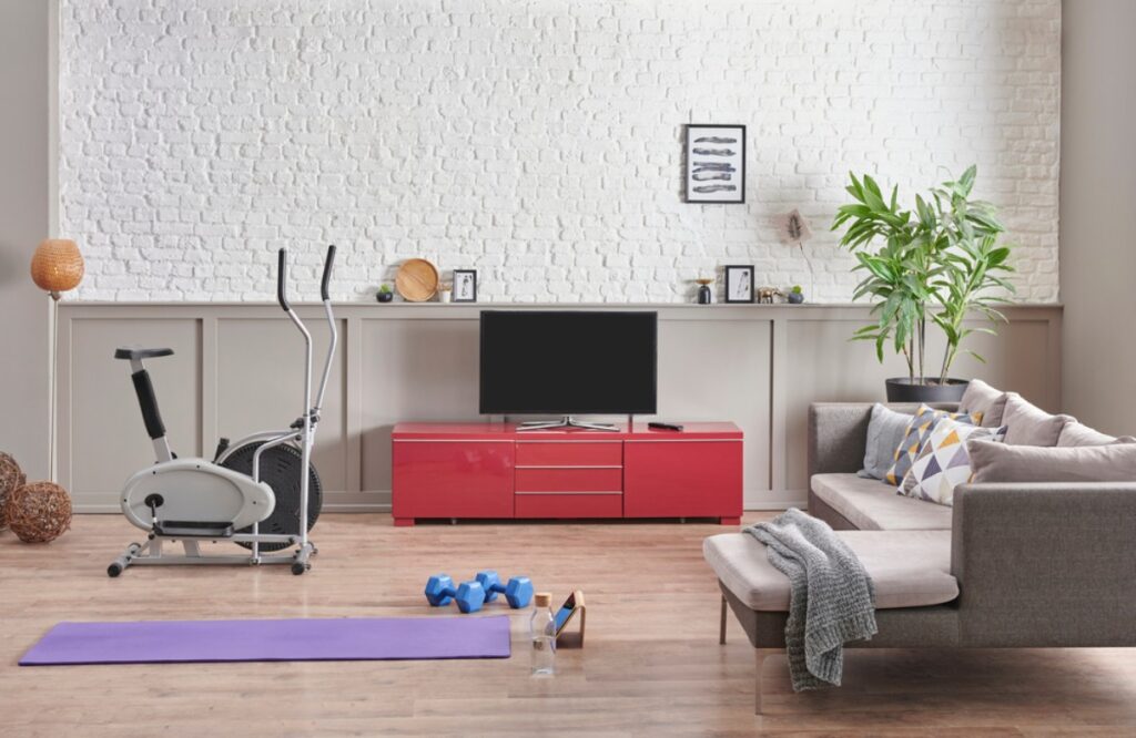 Transform a spare bedroom into a mini home gym with yoga mats and dumbbells