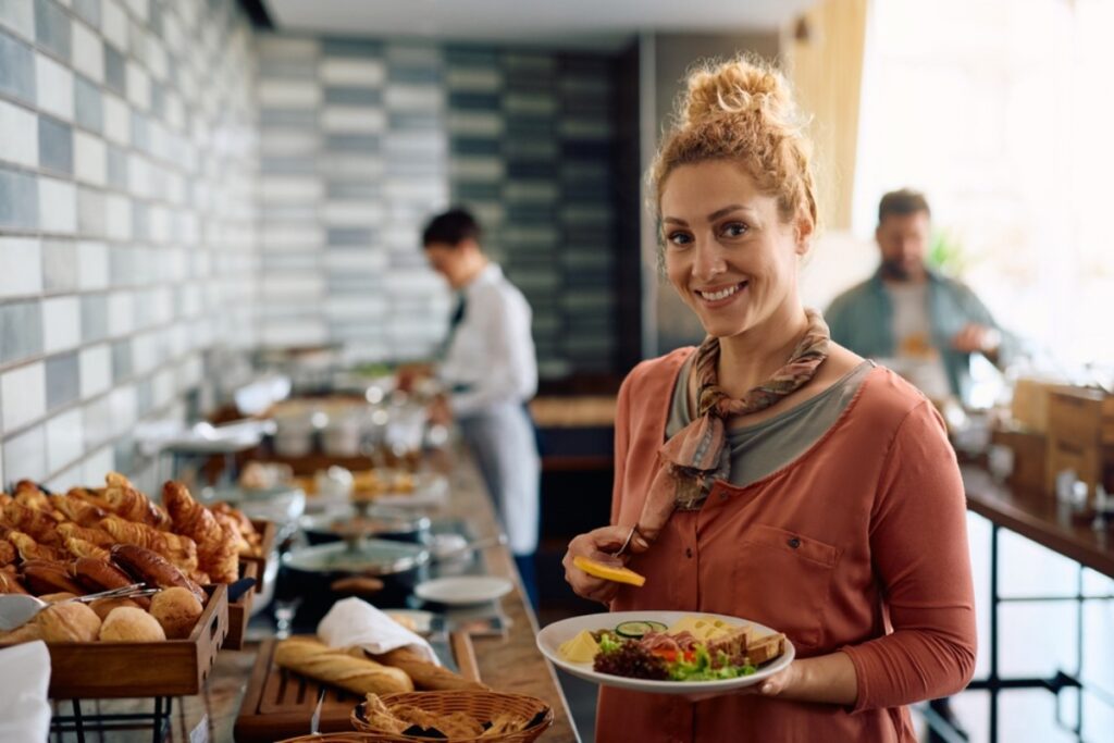 Trying to discreetly sneak snacks from the breakfast buffet before breakfast starts