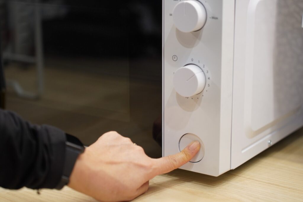 Trying to not press the stop button just to annoy the microwave