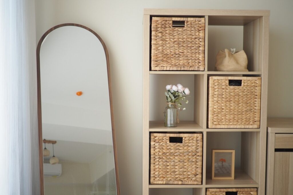 Using storage baskets labeled by category for easy access