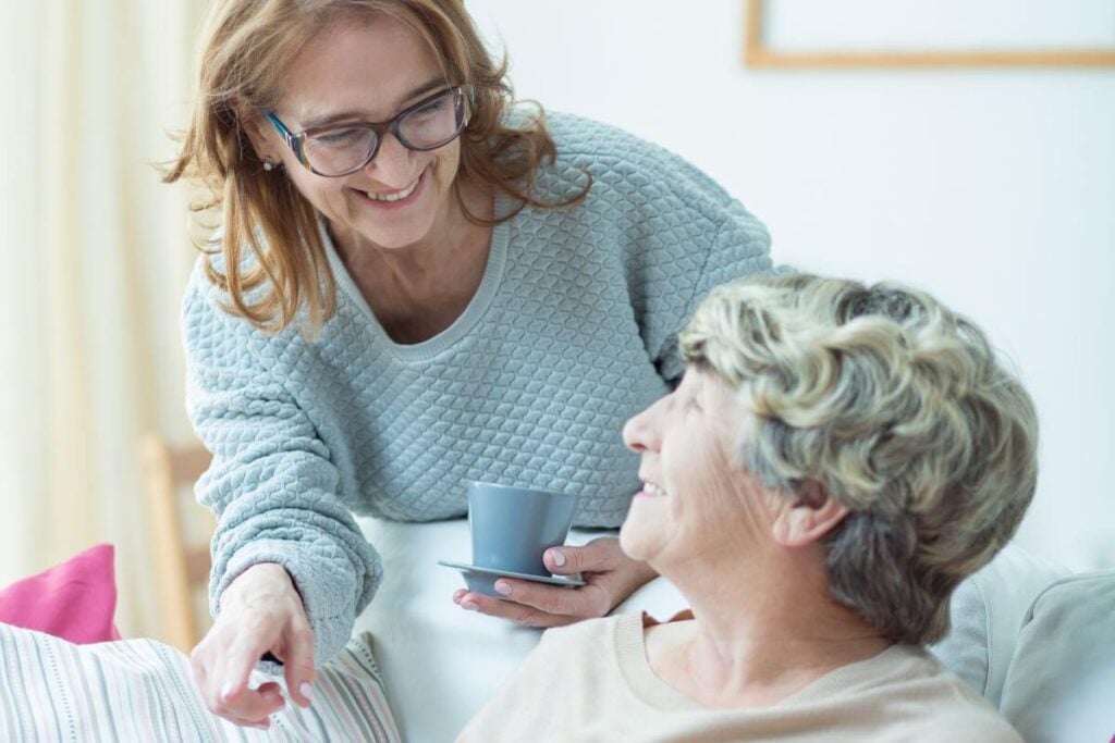 adult daughter taking care of her elderly mother.
