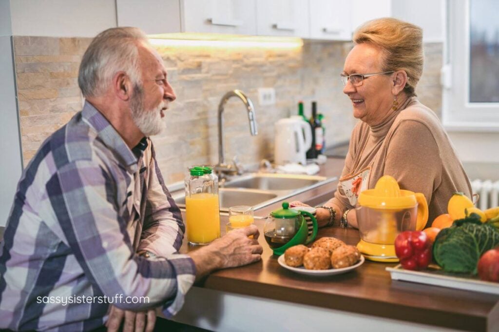 elderly couple enjoys breakfast in a well-lit accessible kitchen.