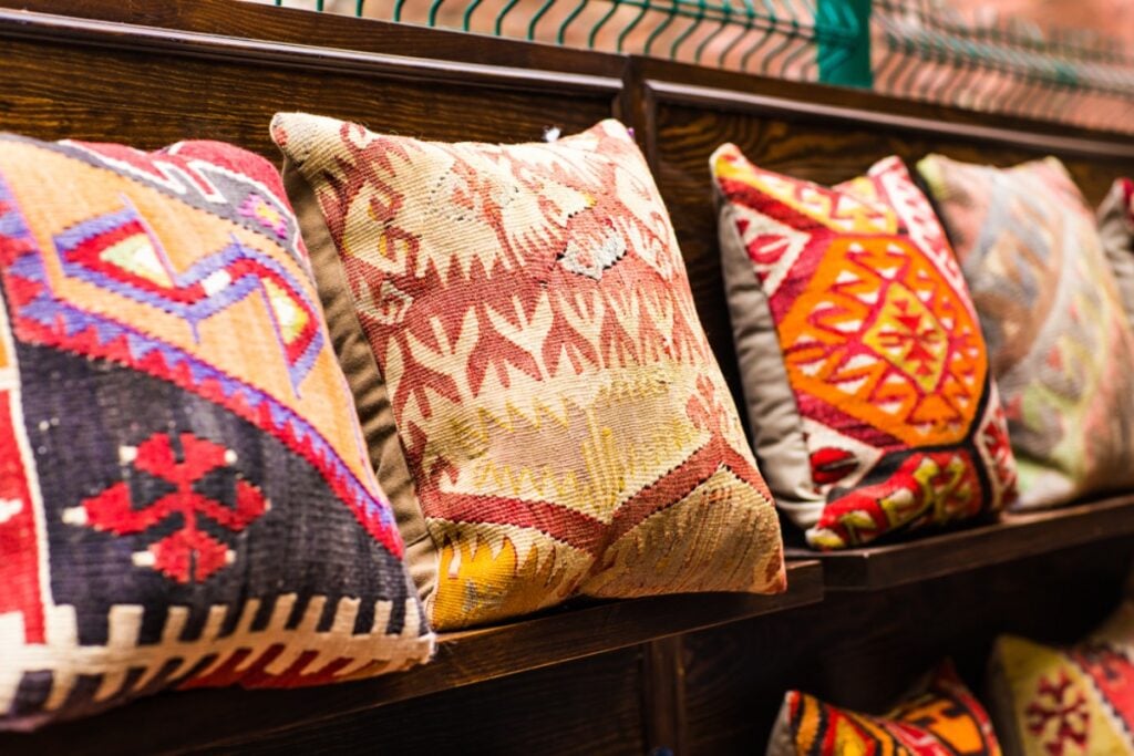 Update throw pillows with bold prints and rich textures