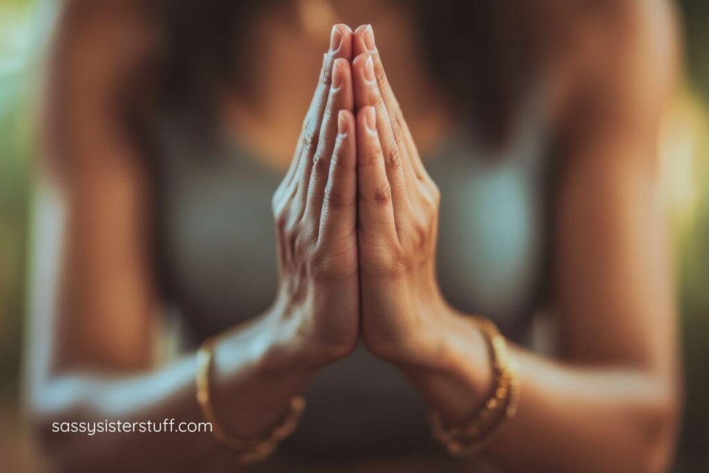 close up of a female's hands clasped in a praying positiong.