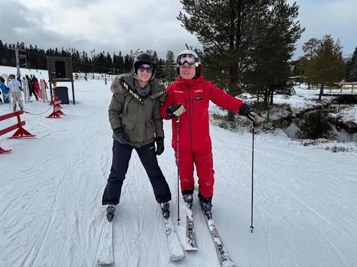 two skiers on a mountain.