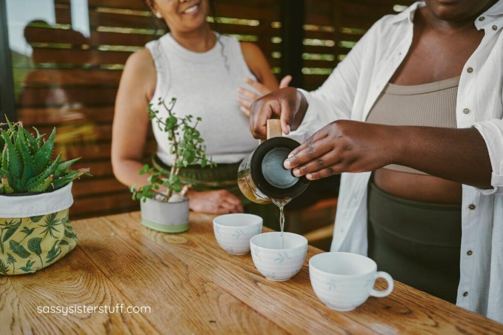 a close up of two women learning about herbal teas and essential oils after reviewing some midlife adventure ideas.