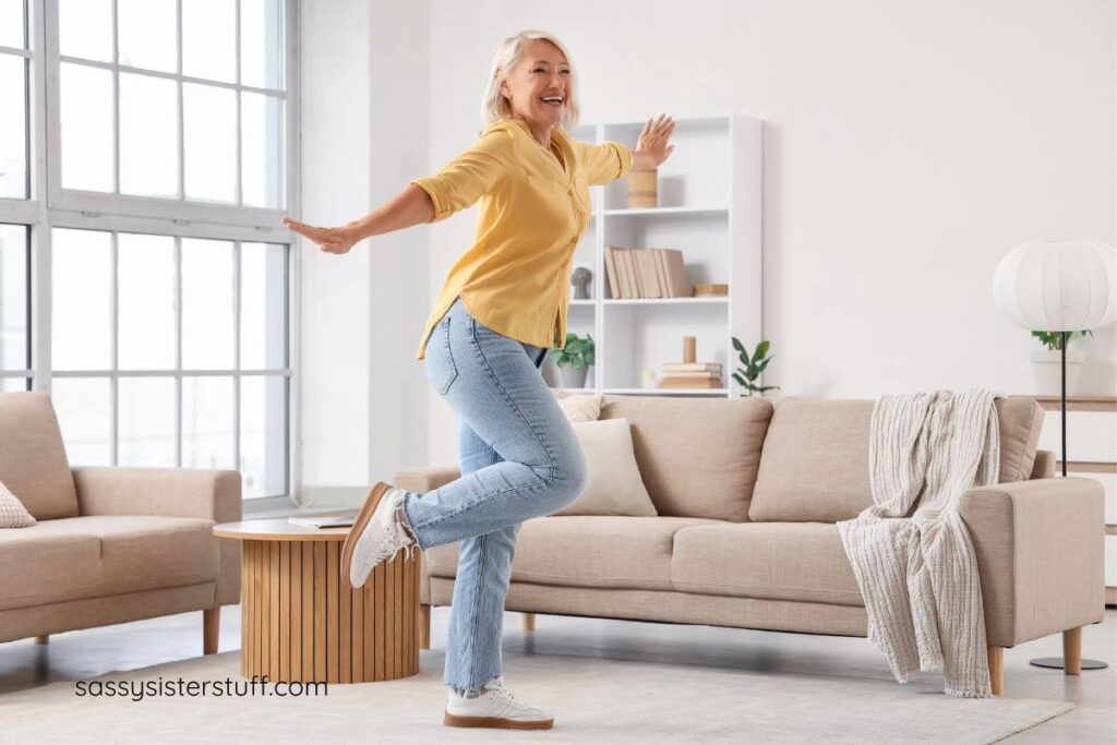 midlife woman dancing joyfully in her living room.
