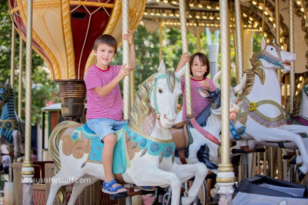 children riding a carousel.