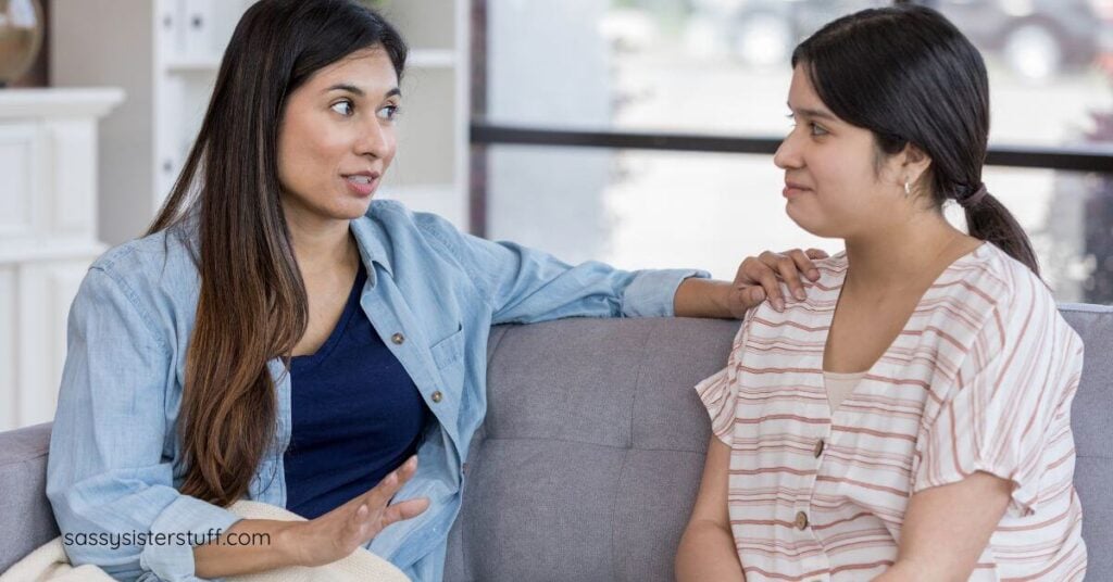 a friend gently and respectfully speaks to another friend about boudaries.