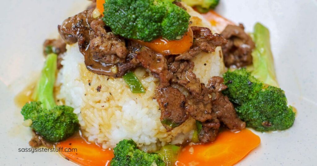 plate of beef, vegetables, and rice.