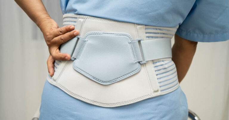 woman wearing a backbrace because she was injured by a new product.