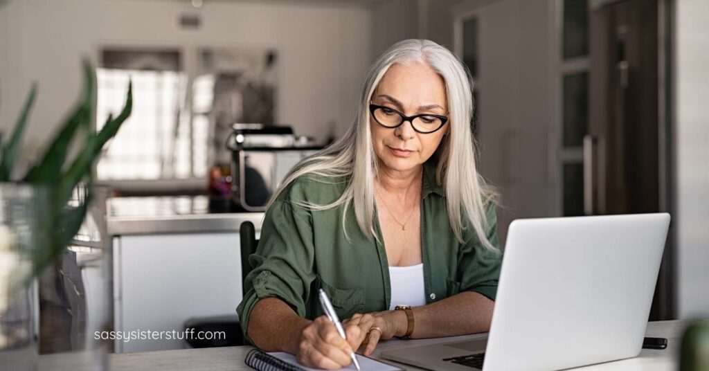 middle age woman working at her desk.