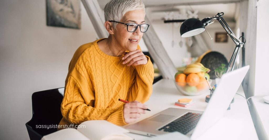 middle age woman working at her modern desk.