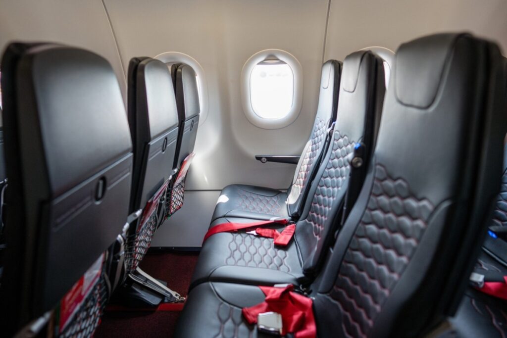 Plane seats aren’t deep cleaned between flights, making exposed skin contact risky.