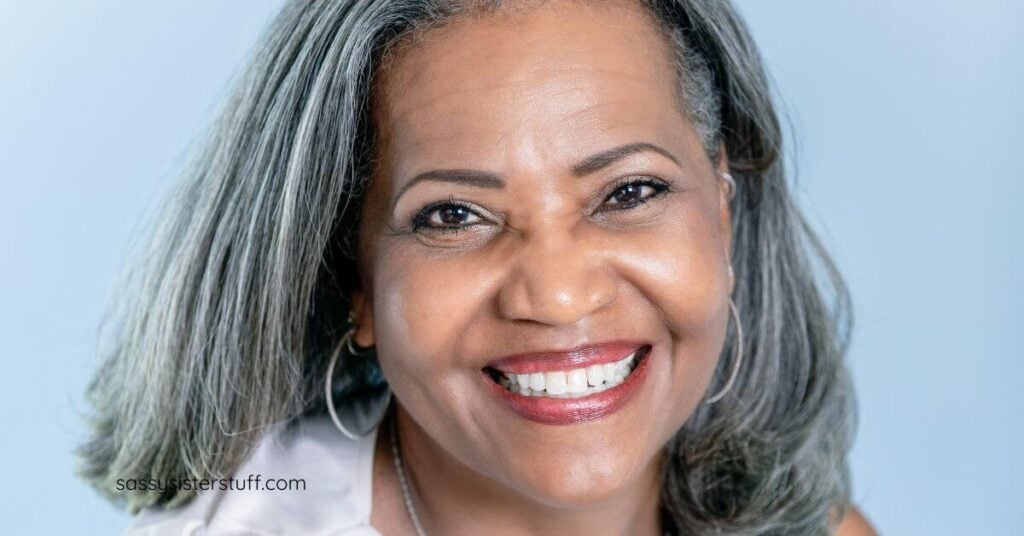 beautiful midlife black woman with partially gray hair.