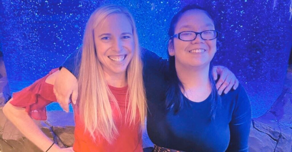 Pam and adopted daughter Kesley pose with their arms around each other's shoulders.