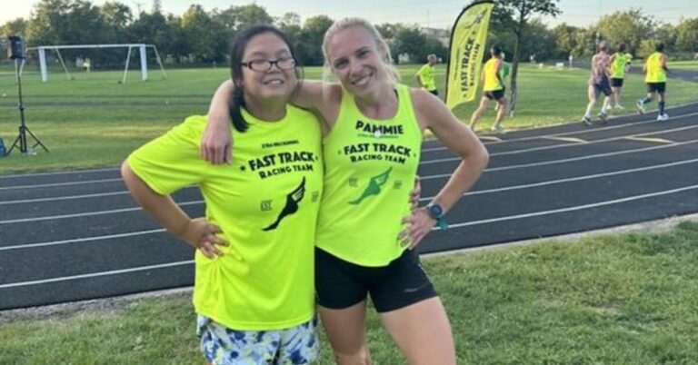 Kelsey and Pam pose with their arms around each other after a race.