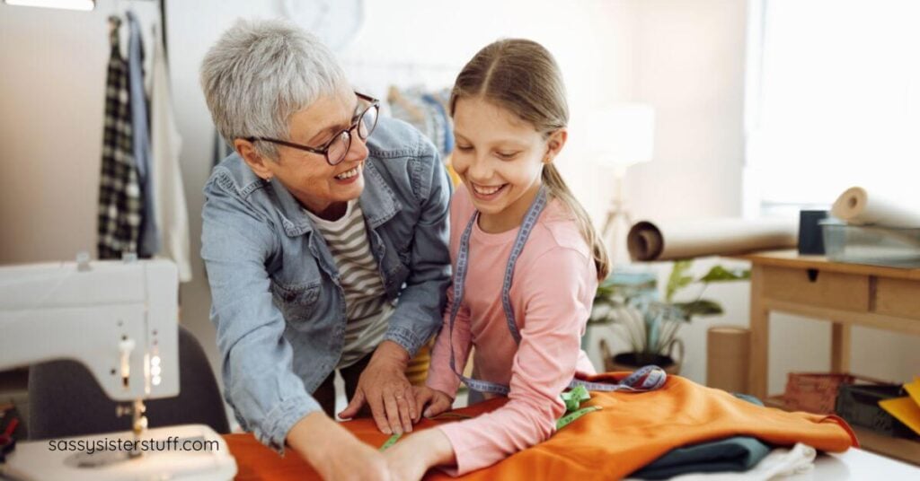 grandmother and granddaughter sewing together as the elder questions what do you want your legacy to be?