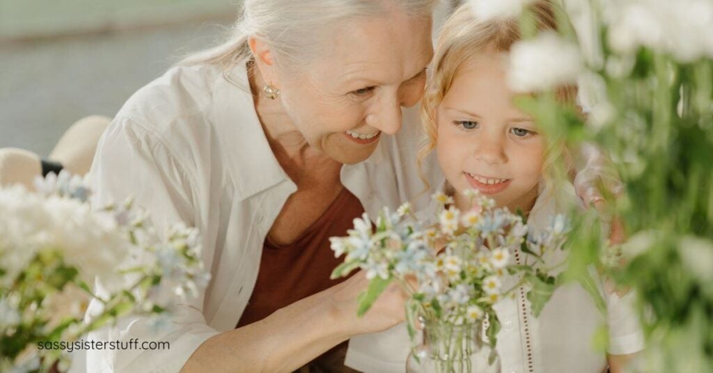 grandmother teaches her young granddaughter about flowers as the elder questions what do you want your legacy to be?