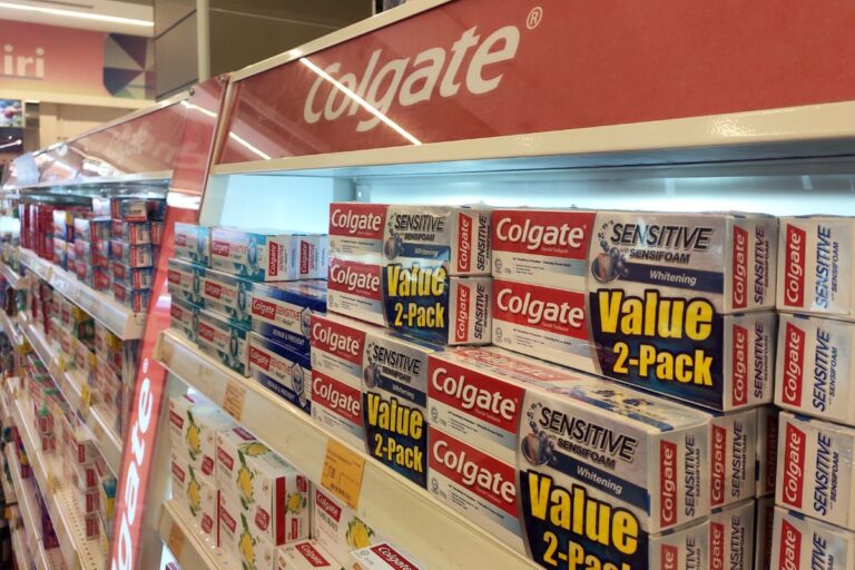 tooth paste behind glass at a store