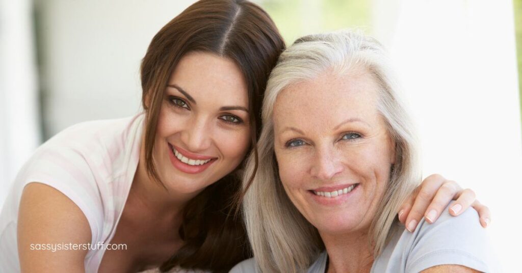 mother and adult daughter head to head smiling for the camera on a vacation they planned to connect with each other.