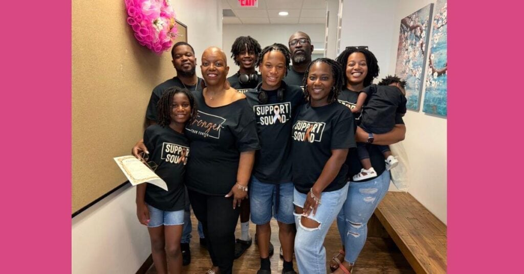 a family stands in support of their mom who has just finished chemo and radiation for endometrial cancer.