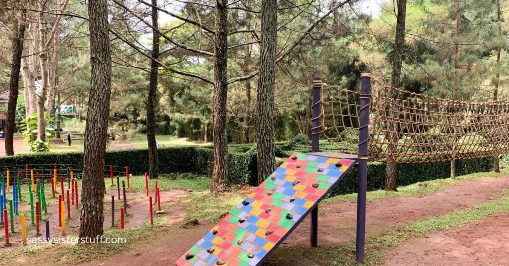 an grown-up obstacle course in the woods for the many benefits of adventure in midlife.