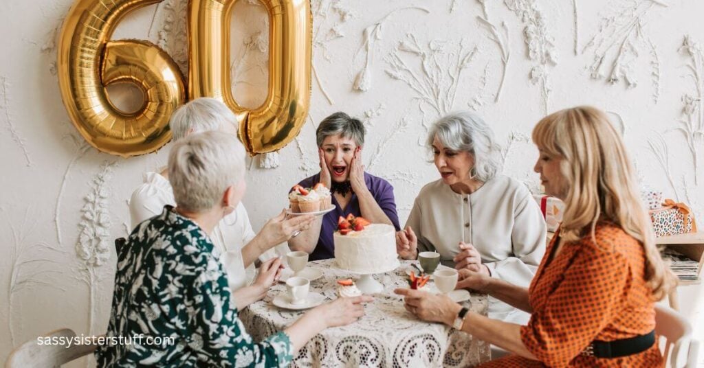 five ladies share tea and a strawberry cake to quietly celebrate one of their 60th birthdays.
