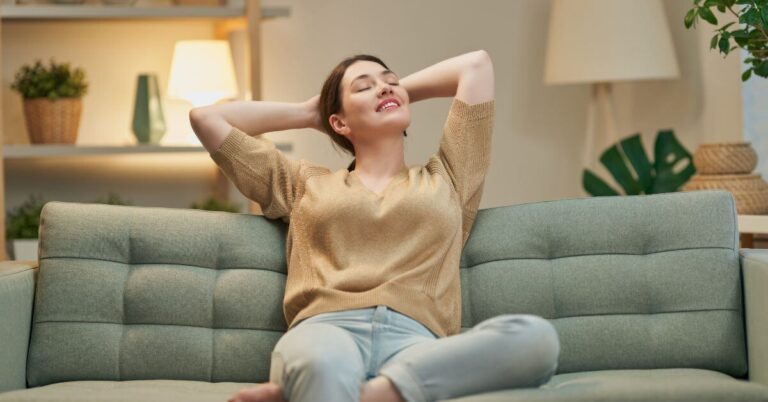 a happy midlife woman has taken a nap and rested so she's ready for the rest of the day.