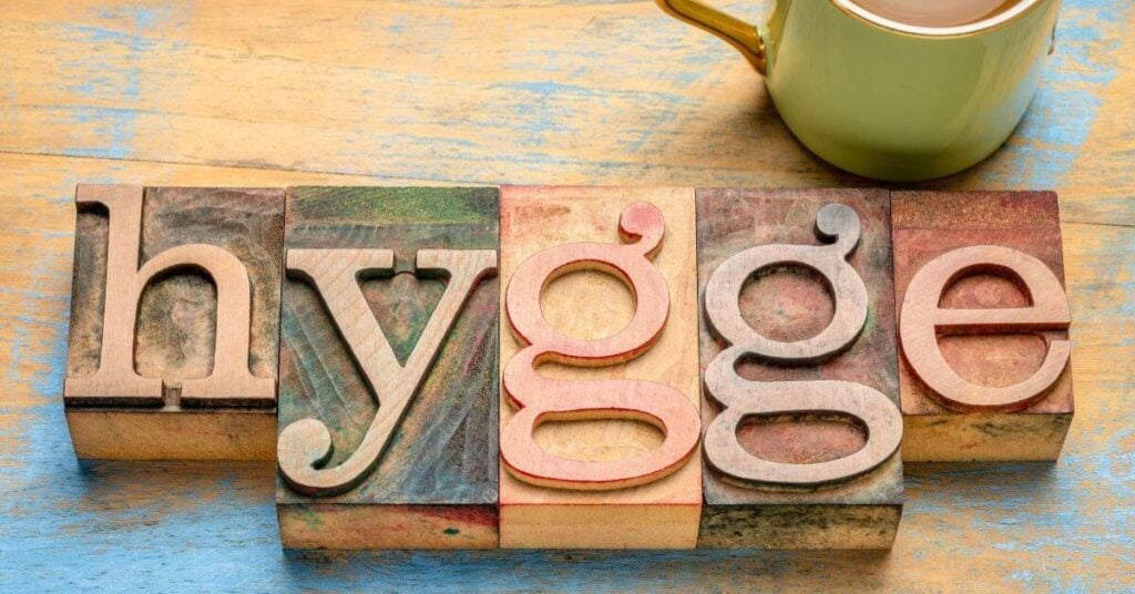 the word HYGGE laying on a table in blocks.