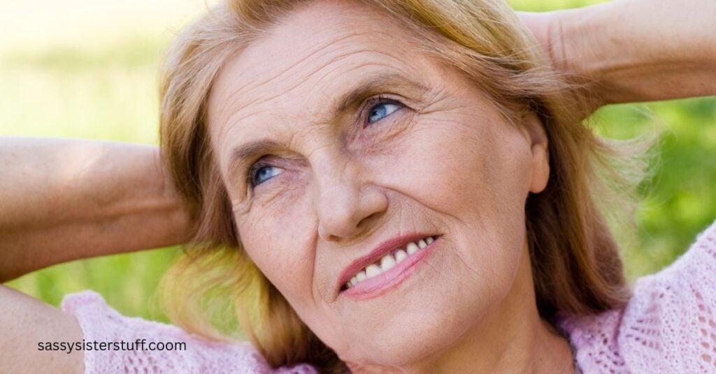 woman sits with her hands folded behind her head pondering if life is over at 50.