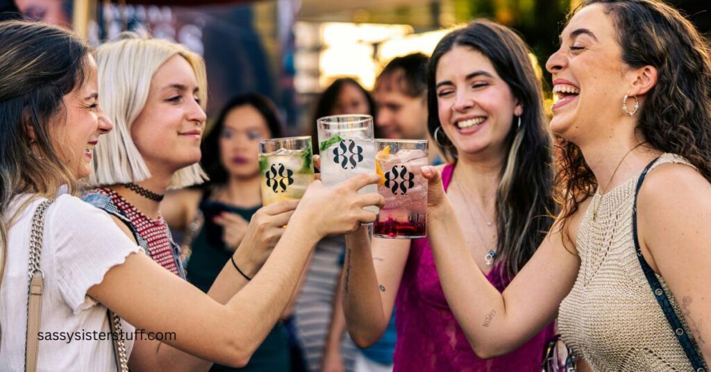 four women toasting to their social wellness.