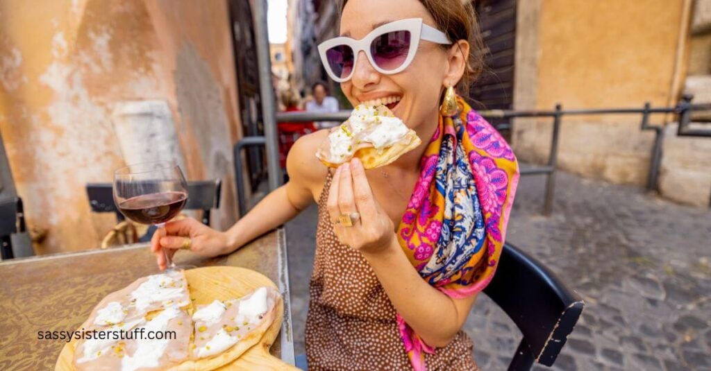 female visitor in Italy enjoying a glass of wine and white pizza alone.