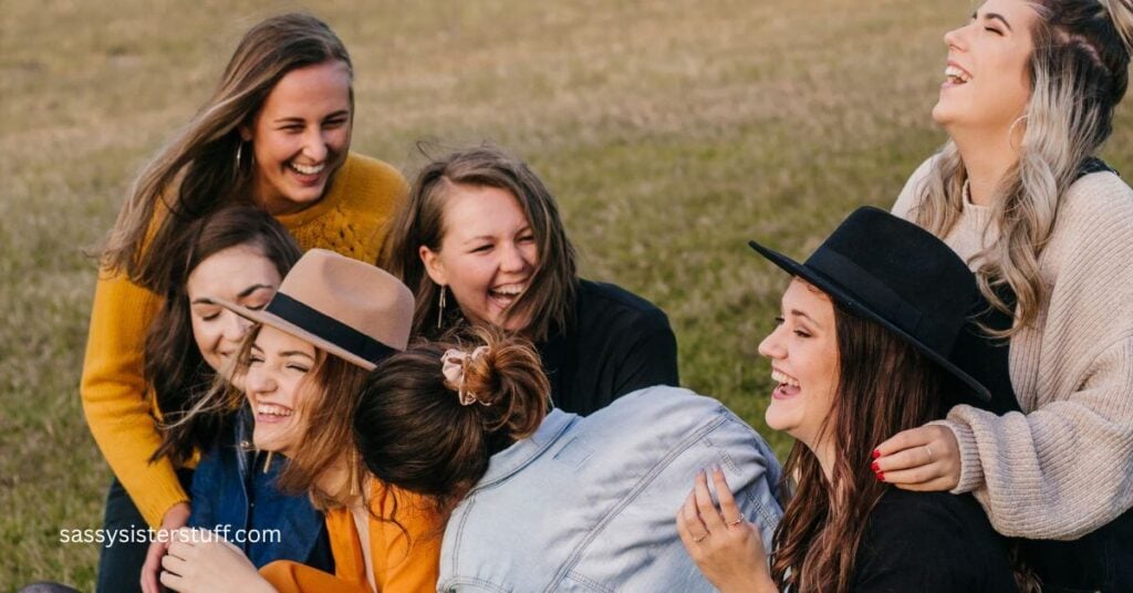 a group of 7 girlfriends who are working to build a support system to reduce stress laugh together in a field.